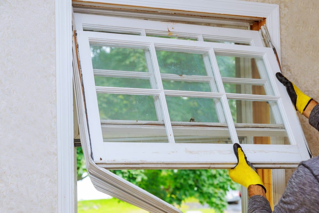 What You Need To Know About Replacing Your Doors And Windows - Worker Hand Removing Old Window Replacing The Old Wooden Window T20 29Rog6